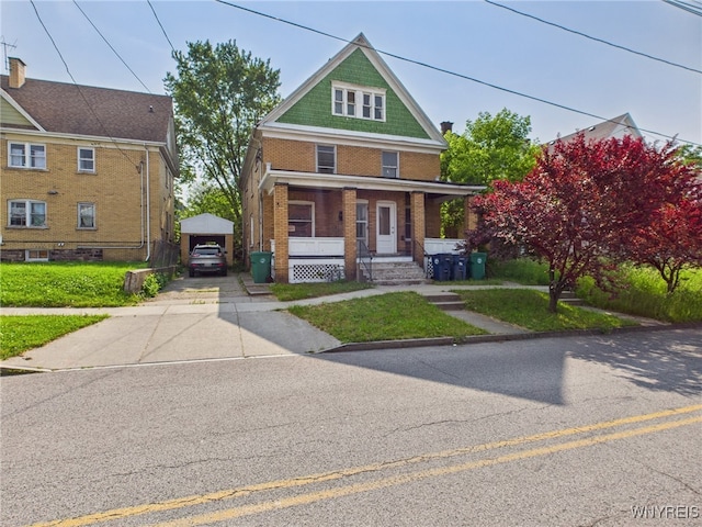 465 10th St, Niagara Falls, NY 14303 - traditional style home with covered porch, brick siding, concrete driveway, and a front yard