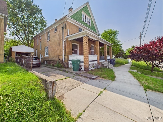 465 10th St, Niagara Falls, NY 14303 - view of side of home featuring covered porch and brick siding