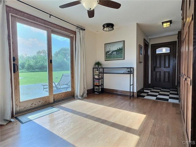 7294 Chase Rd, Pompey, NY 13063 - entrance foyer with wood finished floors, a ceiling fan, and baseboards