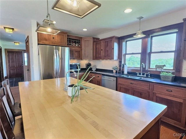 7294 Chase Rd, Pompey, NY 13063 - kitchen featuring appliances with stainless steel finishes, a sink, hanging light fixtures, recessed lighting, and a center island