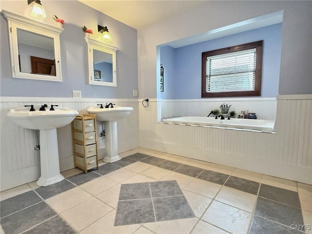 7294 Chase Rd, Pompey, NY 13063 - full bath featuring wainscoting, a bath, tile patterned flooring, and a sink