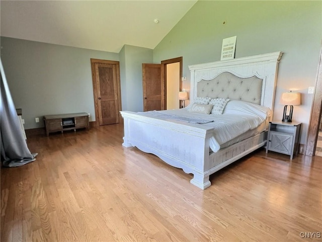 7294 Chase Rd, Pompey, NY 13063 - bedroom featuring wood finished floors, high vaulted ceiling, and baseboards