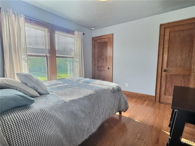 7294 Chase Rd, Pompey, NY 13063 - bedroom featuring wood finished floors and baseboards