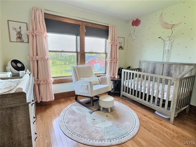 7294 Chase Rd, Pompey, NY 13063 - bedroom with multiple windows, wood finished floors, and a nursery area