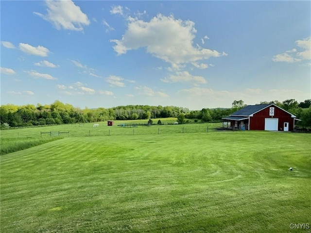 7294 Chase Rd, Pompey, NY 13063 - view of yard featuring a pole building, a view of rural / pastoral area, a garage, and an outdoor structure