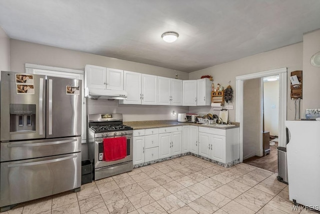 2238 Independence Ave, Niagara Falls, NY 14301 - kitchen with appliances with stainless steel finishes, under cabinet range hood, white cabinetry, and light marble finish flooring