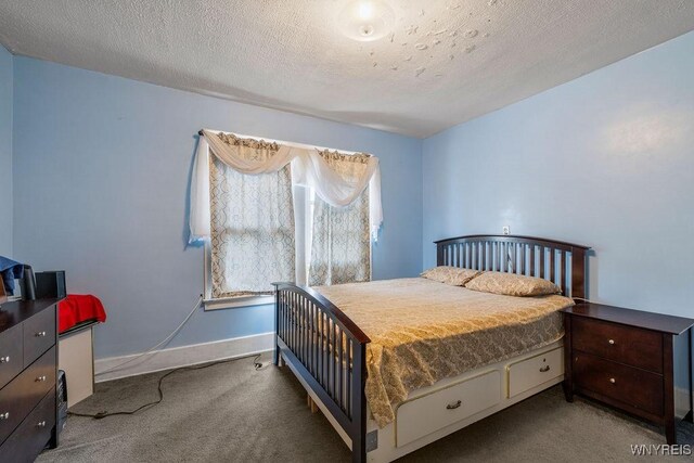 2238 Independence Ave, Niagara Falls, NY 14301 - carpeted bedroom featuring a textured ceiling and baseboards