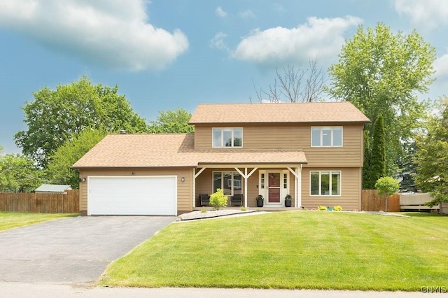 4292 Persimmon, Clay, NY 13090 - view of front facade featuring asphalt driveway, a garage, and a porch