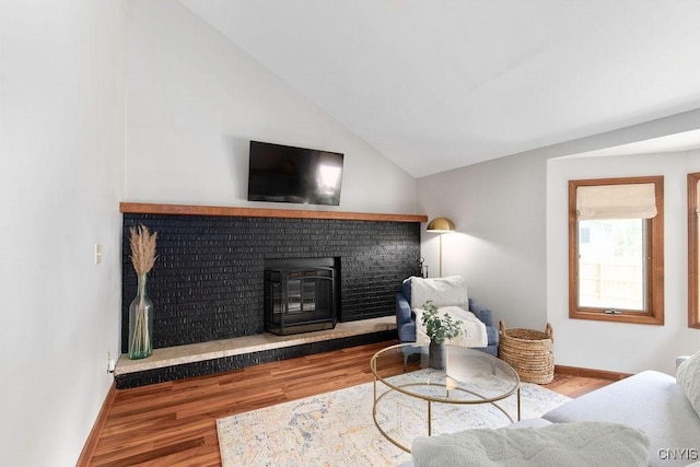 4292 Persimmon, Clay, NY 13090 - living room with wood finished floors, vaulted ceiling, and baseboards
