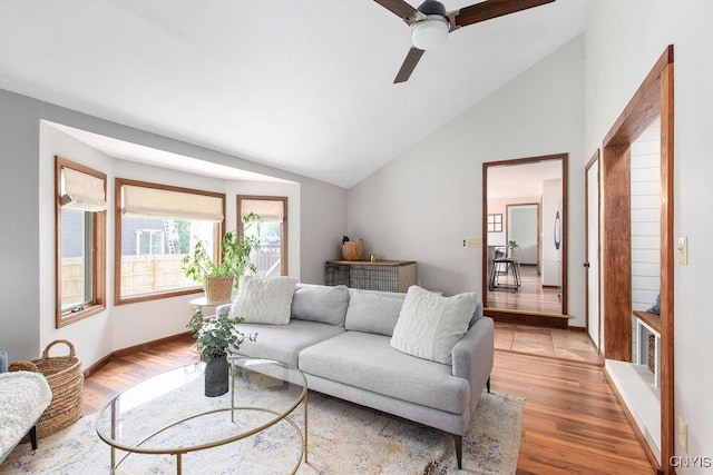 4292 Persimmon, Clay, NY 13090 - living area with lofted ceiling, ceiling fan, and light wood-style floors