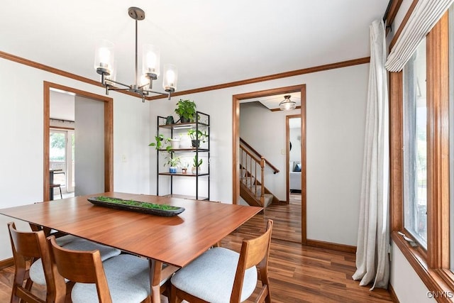 4292 Persimmon, Clay, NY 13090 - dining space featuring wood finished floors, a chandelier, baseboards, ornamental molding, and stairway