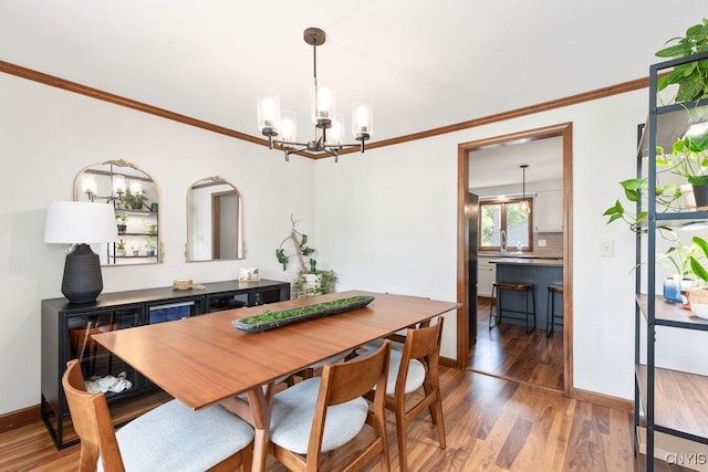 4292 Persimmon, Clay, NY 13090 - dining space with a chandelier, ornamental molding, wood finished floors, and baseboards