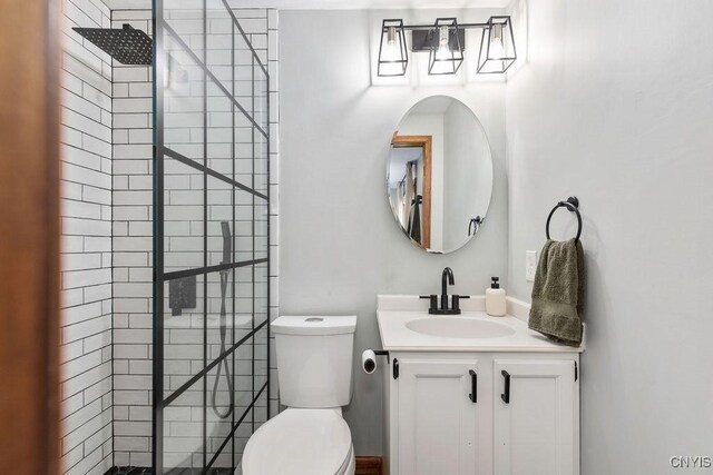 4292 Persimmon, Clay, NY 13090 - full bathroom featuring a tile shower, vanity, and toilet