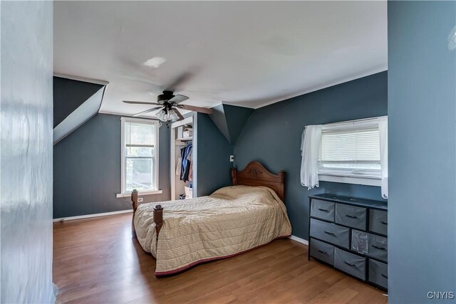 25 Waid St, Gouverneur, NY 13642 - bedroom with wood finished floors, baseboards, ceiling fan, and a closet