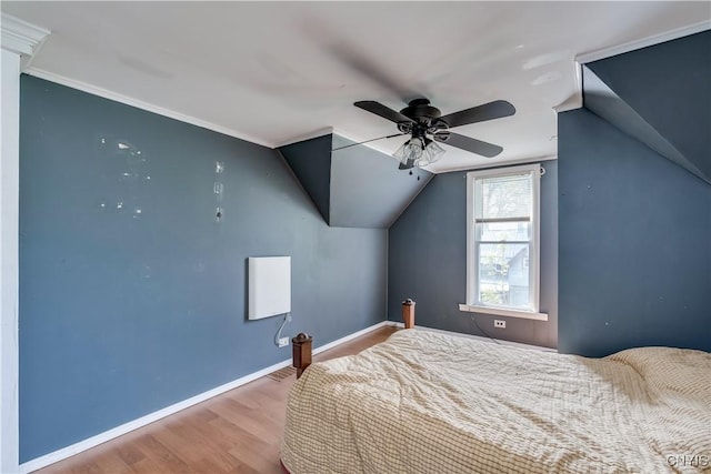 25 Waid St, Gouverneur, NY 13642 - bedroom with wood finished floors, vaulted ceiling, baseboards, and a ceiling fan