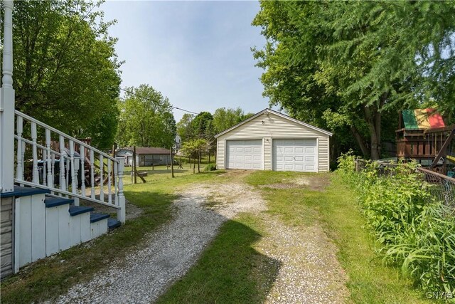 25 Waid St, Gouverneur, NY 13642 - view of yard featuring a garage, an outbuilding, and stairway