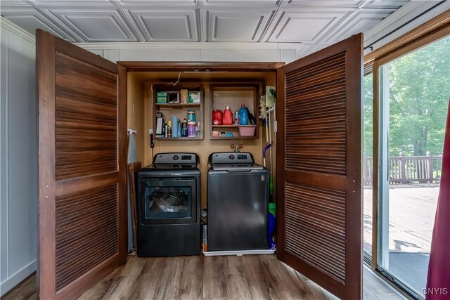 25 Waid St, Gouverneur, NY 13642 - laundry area with separate washer and dryer, plenty of natural light, an ornate ceiling, and wood finished floors