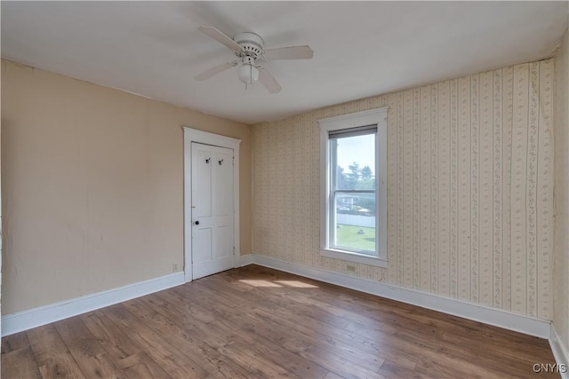 25 Waid St, Gouverneur, NY 13642 - unfurnished room with wood finished floors, ceiling fan, and baseboards