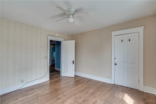 25 Waid St, Gouverneur, NY 13642 - unfurnished bedroom featuring wood finished floors, baseboards, and a ceiling fan