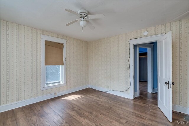 25 Waid St, Gouverneur, NY 13642 - empty room featuring wood finished floors, a ceiling fan, and baseboards