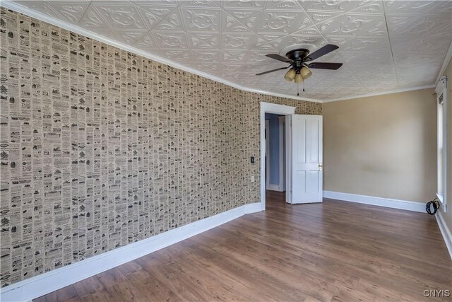 25 Waid St, Gouverneur, NY 13642 - spare room featuring baseboards, a ceiling fan, an ornate ceiling, wood finished floors, and crown molding