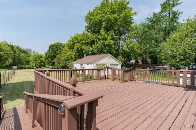 25 Waid St, Gouverneur, NY 13642 - wooden deck with an outdoor structure, a garage, and view of scattered trees