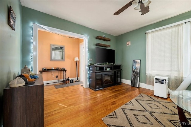 817 Mildred Ave, Utica, NY 13502 - living area with a ceiling fan, wood finished floors, and baseboards