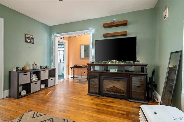 817 Mildred Ave, Utica, NY 13502 - living area featuring wood finished floors and baseboards