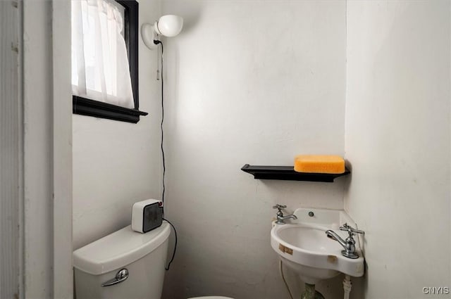 817 Mildred Ave, Utica, NY 13502 - half bathroom featuring toilet and a sink