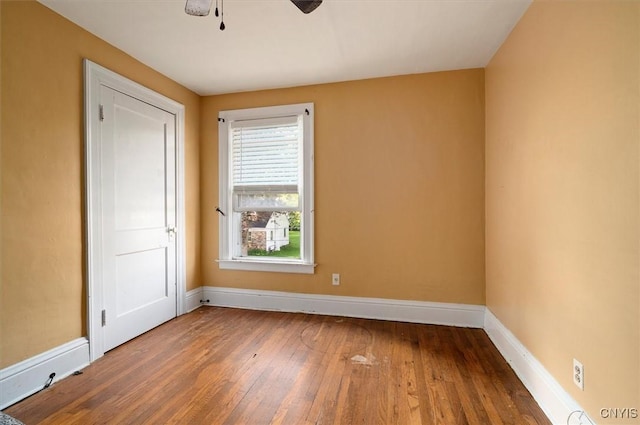 817 Mildred Ave, Utica, NY 13502 - empty room with hardwood / wood-style floors, baseboards, and ceiling fan