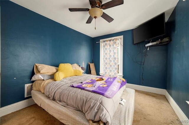817 Mildred Ave, Utica, NY 13502 - carpeted bedroom featuring baseboards and ceiling fan