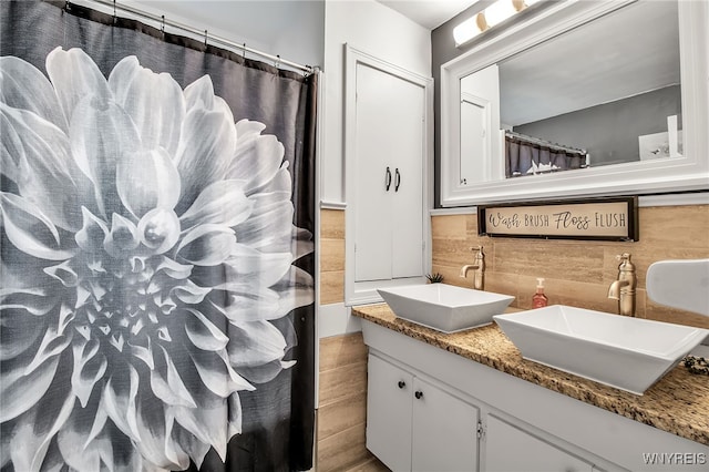 126 Midland Dr, Cheektowaga, NY 14225 - bathroom featuring double vanity, tasteful backsplash, and curtained shower