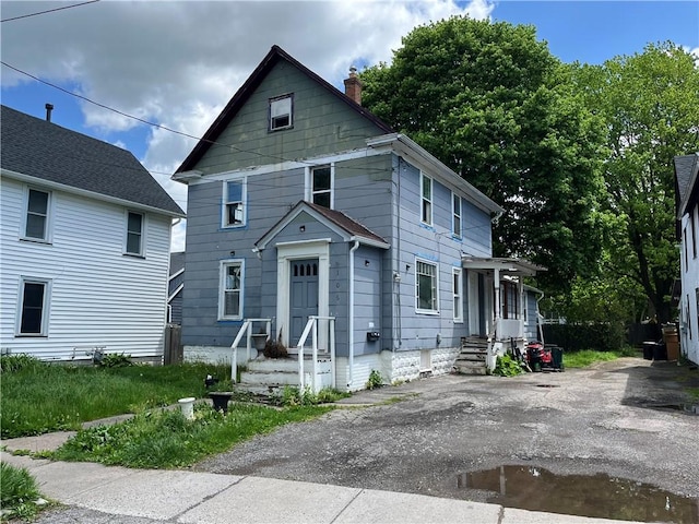 106 Madison St, East Rochester, NY 14445 - view of front of property featuring a chimney