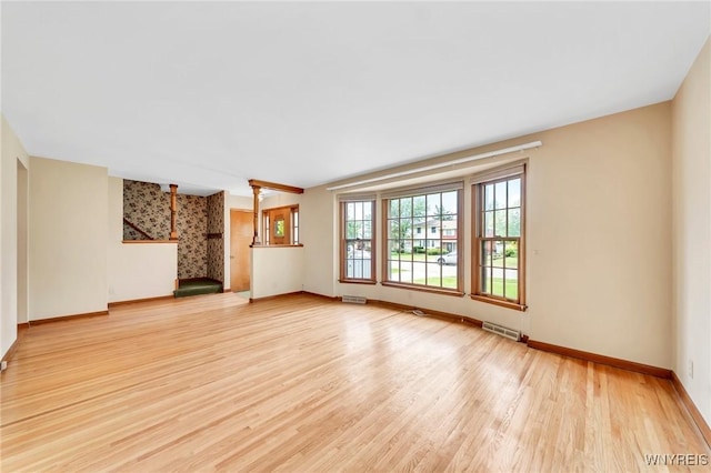 27 Lynn Lea St, Amherst, NY 14221 - unfurnished living room with baseboards and light wood finished floors