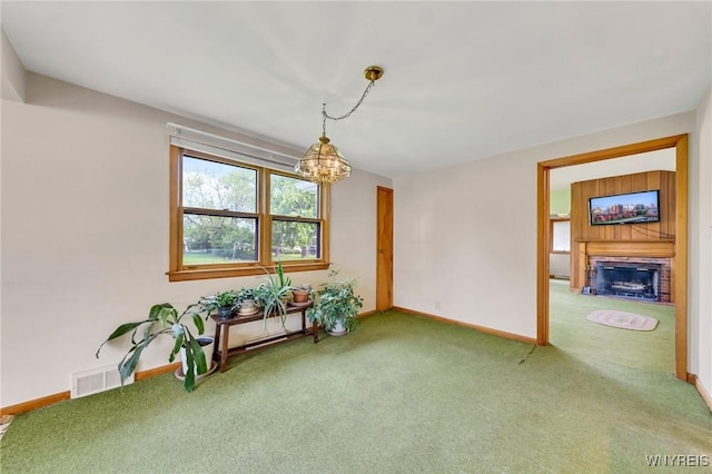 27 Lynn Lea St, Amherst, NY 14221 - dining area featuring carpet, a fireplace, a chandelier, and baseboards
