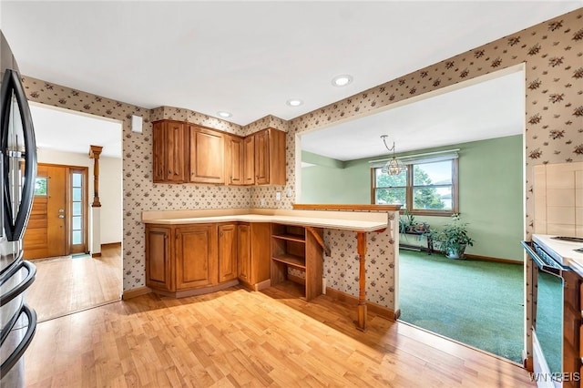 27 Lynn Lea St, Amherst, NY 14221 - kitchen featuring wallpapered walls, white electric range oven, freestanding refrigerator, baseboards, and light wood-type flooring