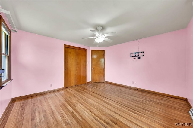 27 Lynn Lea St, Amherst, NY 14221 - unfurnished bedroom featuring light wood-type flooring, baseboards, ceiling fan, and a closet