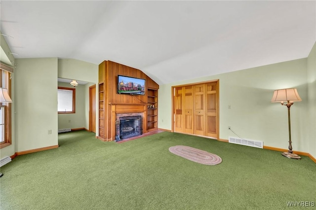 27 Lynn Lea St, Amherst, NY 14221 - unfurnished living room with vaulted ceiling, baseboards, carpet floors, a fireplace, and a baseboard heating unit