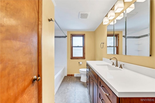 27 Lynn Lea St, Amherst, NY 14221 - bathroom with baseboards, toilet, vanity, wood finished floors, and washtub / shower combination