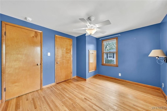 27 Lynn Lea St, Amherst, NY 14221 - unfurnished bedroom featuring baseboards, wood finished floors, and a ceiling fan