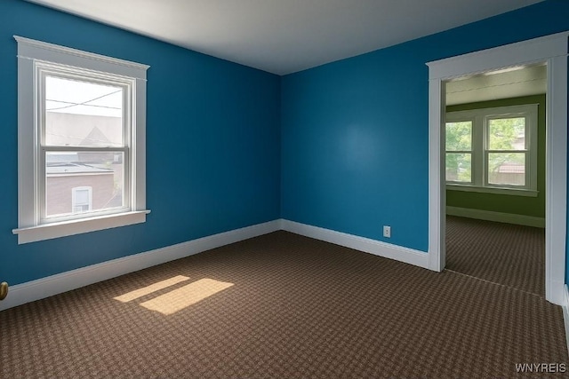 472 Leroy Ave, Buffalo, NY 14215 - spare room with dark carpet and baseboards