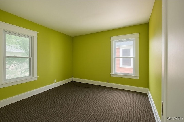 472 Leroy Ave, Buffalo, NY 14215 - unfurnished room featuring baseboards and dark carpet