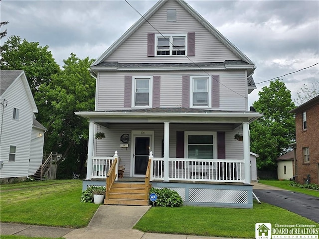 136 N 10th St, Olean-City, NY 14760 - traditional style home with a porch, a front lawn, and a shingled roof