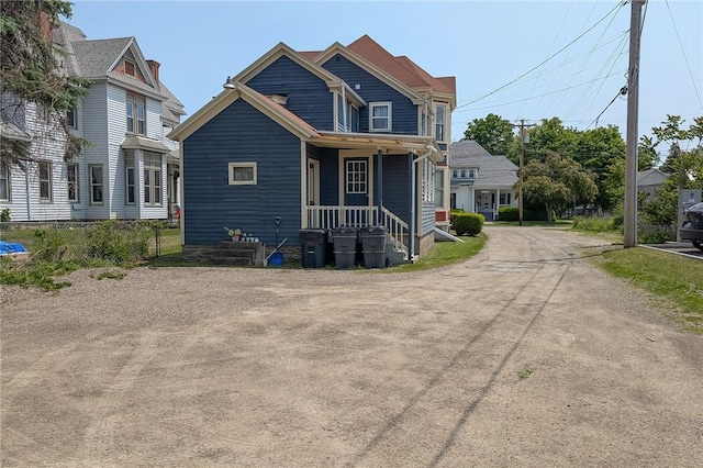 5 Gansevoort St, Bath, NY 14810 - view of front facade with driveway and a porch