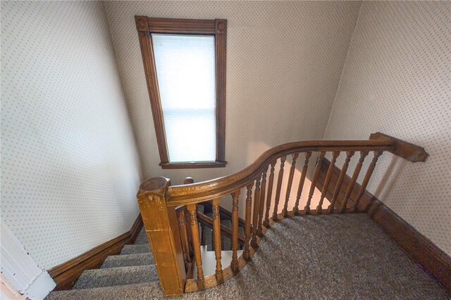 5 Gansevoort St, Bath, NY 14810 - staircase with wallpapered walls, baseboards, and carpet floors