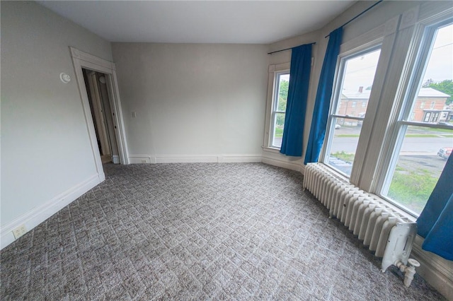 5 Gansevoort St, Bath, NY 14810 - empty room featuring radiator and carpet floors