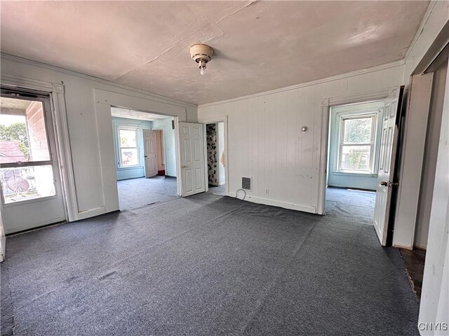 1504 Conkling Ave, Utica, NY 13501 - unfurnished room featuring dark carpet, crown molding, and baseboards
