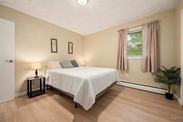 1 Christopher Cir, New Hartford, NY 13413 - bedroom with light wood-type flooring, baseboard heating, and baseboards
