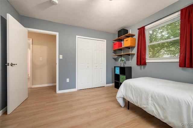 1 Christopher Cir, New Hartford, NY 13413 - bedroom featuring light wood-style flooring, baseboards, and a closet