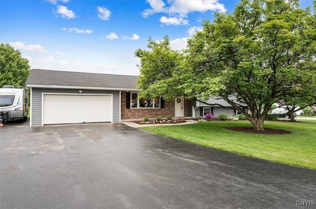 1 Christopher Cir, New Hartford, NY 13413 - view of front facade with an attached garage, driveway, and a front yard